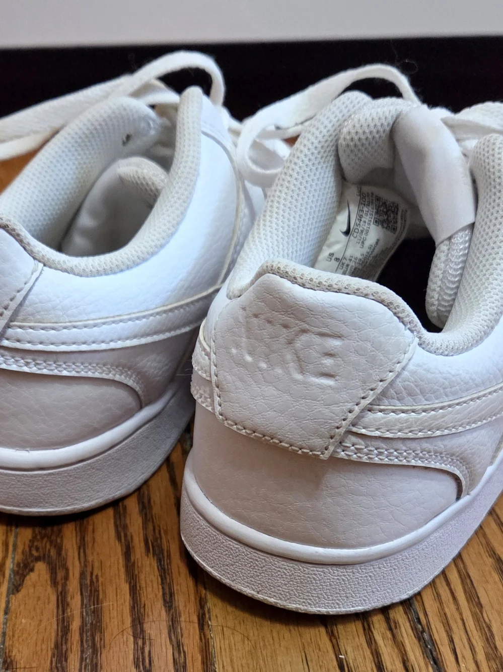 Nike Women’s Classic All-White Leather Court Vision Sneakers